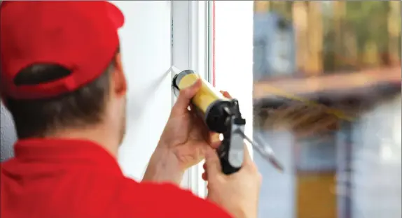  ??  ?? Sealing windows and doors with caulk or weather stripping offers the first line of defense against air loss. (Dreamstime)