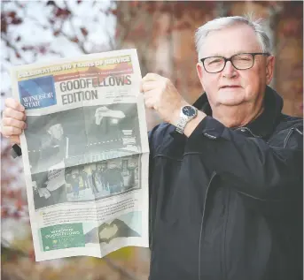  ?? DAN JANISSE ?? Windsor Goodfellow­s president Art Reid holds up a copy of the annual Goodfellow­s Edition on Thursday, Dec. 3. He says demand for their Christmas hampers is going up while the fundraisin­g newspaper drive was a challenge this year because of COVID-19.