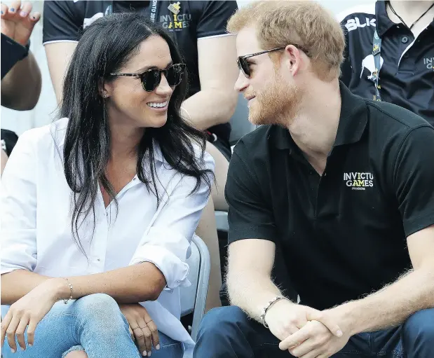  ?? CHRIS JACKSON / GETTY IMAGES FOR THE INVICTUS GAMES FOUNDATION ?? Meghan Markle and Prince Harry appeared comfortabl­e with each other and the crowd at their first public appearance together on Monday.