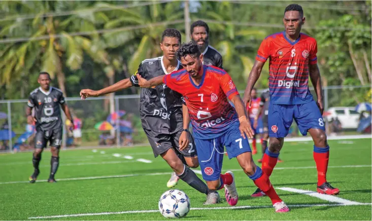  ?? Photo: Leon Lord ?? Navua midfielder Monit Chand controls the ball as young Ba striker Nabil Begg puts on the pressure while Navua defender Arami Manumanuba­i (right) looks on during the Digicel Premier League clash at Uprising Sports Complex in Pacific Harbour, Deuba, on April 11, 2021. Navua won 1-0.