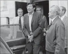  ?? BOB CHILD — THE ASSOCIATED PRESS FILE ?? Guillermo Aillon, center, emerges from the Superior Court House, where he was denied bail on charges he murdered his estranged wife and her parents. Aillon died in 2014, and his remains were disinterre­d from the Connecticu­t State Veterans Cemetery in...