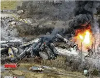  ?? GENE J. PUSKAR / AP ?? Portions of a Norfolk Southern freight train that derailed the night before burn in East Palestine, Ohio, on Feb. 4, 2023. Norfolk Southern on Tuesday agreed to pay $600 million in a class-action lawsuit settlement related to the derailment.