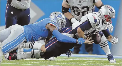  ?? STAFF PHOTO BY NANCY LANE ?? HIT THE DECK: Tom Brady is sacked by Eli Harold during the fourth quarter of the Patriots’ 26-10 loss to the Lions last night at Ford Field in Detroit. The Pats have lost consecutiv­e games for the first time since 2015.