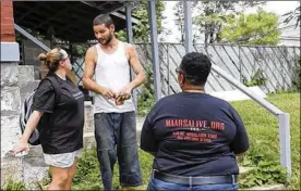  ?? BROOKE LAVALLEY / DISPATCH ?? Jessie Coe (left) talks to Columbus resident Brian Tipton as Jamihla Young listens. Coe and Young are members of Musicians and Artists Addiction Recovery Thru Salvation (MAARS), a group that helps anyone wanting to deal with addiction.