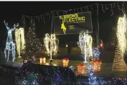  ?? Madison Siedschlag ?? The display for Gibbons Electric of Ansley lights up the night with reindeer, trees and more!