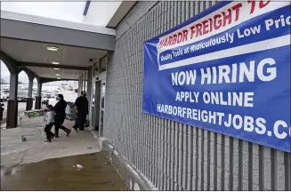  ?? CHARLES KRUPA — THE ASSOCIATED PRESS FILE ?? A “Now Hiring” sign at a Harbor Freight Tools store in Manchester, N.H. The latest figures for jobless claims, remain at levels never seen until the virus struck.