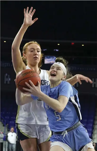  ?? JULIA MALAKIE — LOWELL SUN ?? Dracut’s Ashlee Talbot (5) drives against Foxboro’s Erin Foley during Saturday’s Division 2 state championsh­ip game in Lowell. Foxboro netted a 73-53 win.