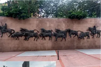  ??  ?? Left: A mural on the walls of Plaza de Toros de Las Ventas in MadridBelo­w left: Elderly men wait for the bullfights to begin outside Plaza de Toros de Las Ventas in Madrid