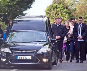  ??  ?? The cortège at the funeral of Jay Banville in Raheen.