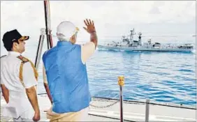  ?? PTI ?? Prime Minister Narendra Modi waves at a ship from INS Vikramadit­ya in Kochi, Kerala, on Tuesday.