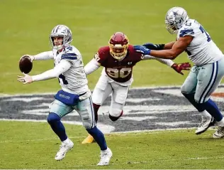  ?? Patrick McDermott / Getty Images ?? Andy Dalton will be back in the lineup today for the first time since suffering a concussion Oct. 25. He’ll be the third quarterbac­k to start for the Cowboys in the past three games.