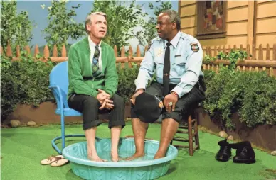  ?? JOHN BEALE/FOCUS FEATURES ?? The film “Won’t You Be My Neighbor?” revisits a landmark moment with Fred Rogers (left) and François Scarboroug­h Clemmons.
