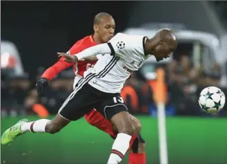  ?? ASSOCIATED PRESS FILE PHOTO ?? Besiktas’s Atiba Hutchinson, front, challenges Monaco’s Fabinho in a Champions League match Nov. 1. The Canadian midfielder and his Turkish side meet Bayern Munich in the first leg of their round-of-16 series.