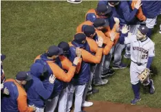  ?? AP photo ?? Houston Astros second baseman Jose Altuve celebrates with teammates after their win against the Boston Red Sox in Game 4 of the League Championsh­ip Series on Wednesday in Boston.