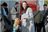  ?? LAWRENCE SMITH / STUFF ?? At the end of a hectic day, Ardern honours a pledge to fire off the questions at Pt Chevalier’s quiz night.