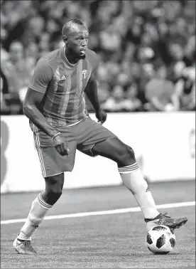  ?? AP FILE ?? Usain Bolt, pictured on the ball during a charity match in France on June 12, has signed an agreement to train with Australian top-flight soccer side the Central Coast Mariners which could potentiall­y lead to a profession­al contract for the legendary sprinter.