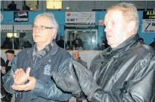  ??  ?? Paul (Jigger) Andrea, left, and Matt Batherson applaud during the closing ceremonies at the North Sydney Forum on March 5, 2011. The two North Sydney residents were longtime figures at the arena. The venue closed in March 2011.
TJ COLELLO • CAPE BRETON POST