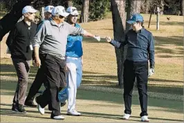  ?? CABINET PUBLIC RELATIONS OFFICE ?? President Donald Trump offers a fist bump Sunday to Japanese leader Shinzo Abe.