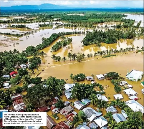  ?? FERDINANDH CABRERA/AFP ?? The flooded municipali­ty of Kabacan, North Cotabato, on the southern island of Mindanao, on Saturday, after Tropical Storm Tembin dumped torrential rains across the island.