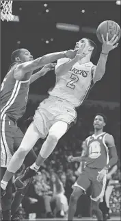  ?? Wally Skalij Los Angeles Times ?? LONZO BALL, shown in December, is back on the court after a six-week absence with a knee injury.