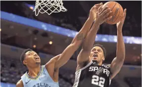  ??  ?? Memphis Grizzlies forward Bruno Caboclo blocks a shot by San Antonio Spurs forward Rudy Gay on Tuesday, Feb. 12, 2019. JOE RONDONE/THE COMMERCIAL APPEAL