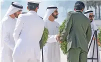  ?? Wam ?? UAE leaders place wreaths in front of the monument in loyalty and gratitude to the sacrifices of the UAE’s martyrs. —