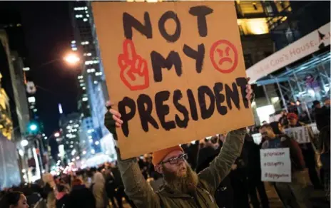  ?? DREW ANGERER/GETTY IMAGES ?? Anti-Donald Trump protesters march on Fifth Avenue in New York City. The U.S. election results have sparked protests in cities across the country.