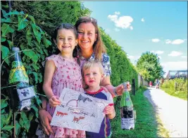  ?? Ref: 30-1420CA ?? Florence Digby-Lister, six, and brother Fred, two, with their mother Gwen Digby, put out the converted bottles