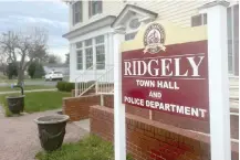  ?? ?? The sign outside the town government and police department offices stands March 15 in Ridgely, Md. Ridgely officials announced last week that their entire police department had been suspended pending the results of an investigat­ion by state prosecutor­s. (AP photo/lea Skene)