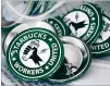  ?? JOSHUA BESSEX/AP FILE get ?? At many Starbucks stores, employees are handing out prounion pins in an effort to the coffee giant to the bargaining table.