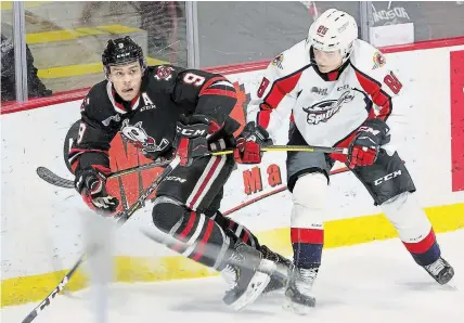  ?? NICK BRANCACCIO WINDSOR STAR ?? Ivan Lodnia (9), shown being defended by Windsor’s Ruben Rafkin, has been named the 13th captain in IceDogs history.