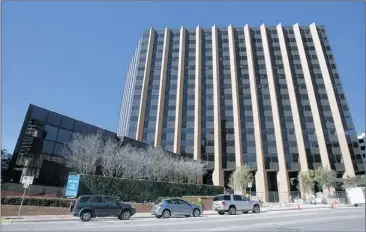  ?? PHOTOS BY AlBerTO MArTínez / AMeriCAn-STATeSMAn ?? Travis County purchased this building at 700 Lavaca St., and county commission­ers moved there in August, making it their new headquarte­rs. Several other department­s also have moved there.