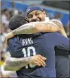  ?? ELSA / GETTY IMAGES ?? Carmelo Anthony (right) hugs Kyrie Irving (four points, four assists, three rebounds) after the U.S. rolled in the gold medal game.