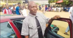  ??  ?? Adamu Hamidu stands near the car he won as best teacher in Plateau State