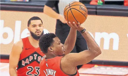  ?? MIKE EHRMANN GETTY IMAGES ?? Kyle Lowry scores his 10,000th point with the Raptors during Wednesday’s game against the Milwaukee Bucks.