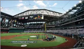  ?? (AP file photo) ?? Globe Life Field in Arlington, Texas — shown here before Game 3 of the National League division series in October — is the only MLB stadium allowing full fan capacity as the season begins. The only other stadium that will allow at least 50% of fan capacity is Minute Maid Park in Houston.