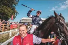  ?? Rex Features ?? Donnacha O’Brien on Latrobe celebrates after the victory at the Curragh Racecourse.