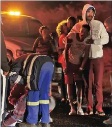  ??  ?? EMOTIONAL: The father of the two deceased woman, Johannes van Wyk, collapsed at the scene of the accident after finding out his children had died.