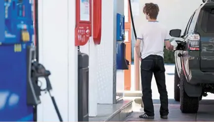  ?? ?? At risk: a customer refuels a vehicle at a petrol station in los angeles. For the oil market, everything depends now on how israel’s response is to iran’s missile attack and the chance of a cycle of escalation. — Bloomberg