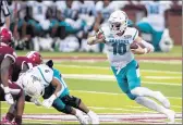  ?? VASHA HUNT/AP ?? Coastal Carolina quarterbac­k Grayson McCall (10) runs the ball against Troy during the first half. McCall led the Chantileer­s on a 75-yard game-winning drive in the final minute.