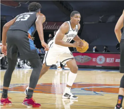  ?? (Photo: AFP) ?? Reggie Perry (centre) of the Brooklyn Nets handles the ball during the game against the New York Knicks at Madison Square Garden in New York City, on Wednesday.