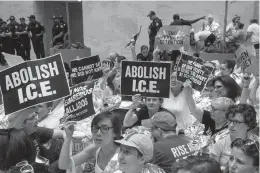  ?? Associated Press ?? ■ Hundreds of activists protest the Trump administra­tion's approach to illegal border crossings and separation of children from immigrant parents Thursday in the Hart Senate Office Building on Capitol Hill in Washington. Several prominent Democrats who...