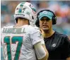  ?? BILL INGRAM / THE PALM BEACH POST ?? Dolphins QB Ryan Tannehill and coach Adam Gase are running an unpredicta­ble offense.