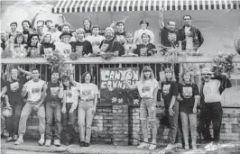  ?? From Tommy Bina ?? TOMMY BINA, above, adorns his Canyon Country Store with art and the 1987 neighborho­od photo.