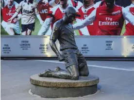  ?? Photograph: Natalie Mincher/SPP/Shuttersto­ck ?? The statue of Thierry Henry outside Arsenal’s home in north London.