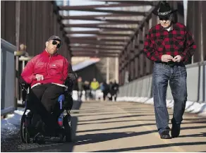  ?? GREG SOUTHAM ?? Ross Wein, shown walking with his son Danny, says access to the river valley and nature is critical to maintainin­g mental health.