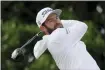  ?? ALASTAIR GRANT — THE ASSOCIATED PRESS ?? Cameron Young plays from the third tee during the first round of the British Open at St. Andrews July 14.