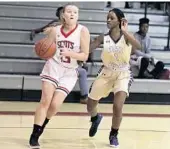  ?? CARLINE JEAN/STAFF PHOTOGRAPH­ER ?? St. Andrew’s Sydney Reiland, left, tries to drive by West Boca defender Melissa Villiene during Friday’s game.