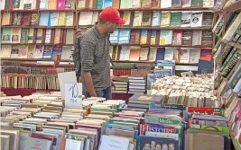 ?? (AFP) ?? A customer browses books at a bookshop in the Moroccan capital Rabat on August 9