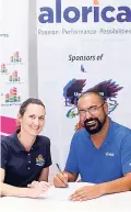  ??  ?? Stanley Motta chairman Melanie Subratie and Alorica Jamaica Country Manager Gilberto Gianareas sign a lease agreement for office space at the 58HWT tech park.